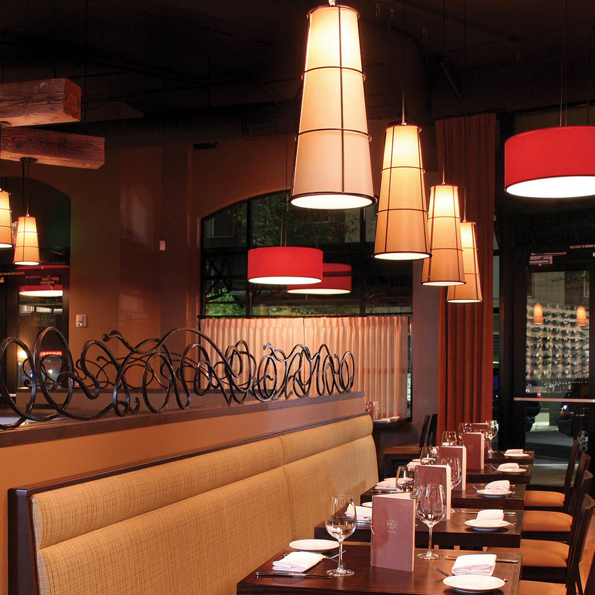 Cone and Drum Shaped Pendant Lighting Hang in Dining Room of Restaurant