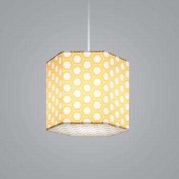 Lumetta's custom Hexagon Lite Pendant is shown with a yellow honeycomb Lumenate® diffuser and a etched honeycomb white acrylic bottom lens.