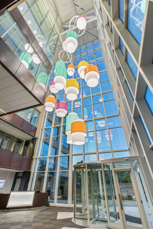 Colorful custom pendant lighting for commercial spaces. Wide range of Lumenate® options and powder coat finishes.