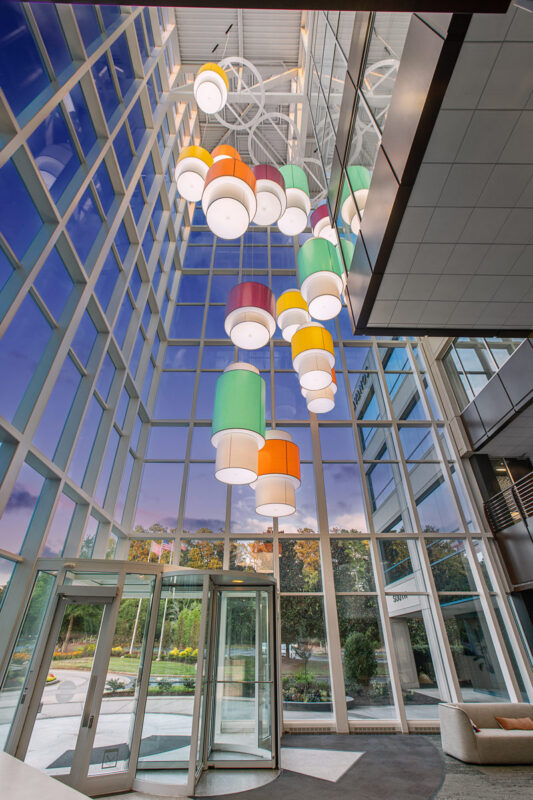 Colorful custom pendant lighting for commercial spaces. Wide range of Lumenate® options and powder coat finishes.